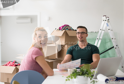 Image of Young couple moving in a new home