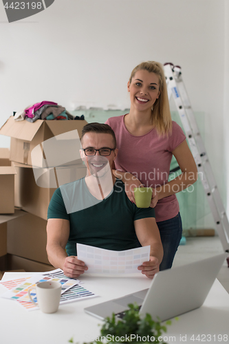 Image of Young couple moving in a new home