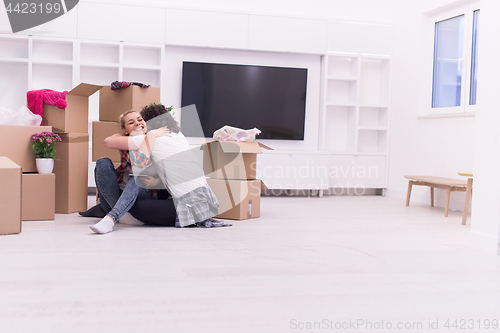 Image of young couple moving  in new house