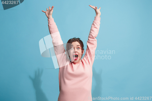 Image of Winning success woman happy ecstatic celebrating being a winner. Dynamic energetic image of female model