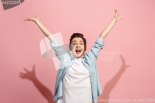 Image of Winning success woman happy ecstatic celebrating being a winner. Dynamic energetic image of female model