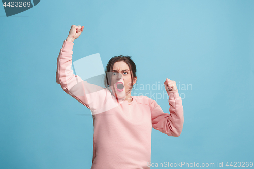 Image of Winning success woman happy ecstatic celebrating being a winner. Dynamic energetic image of female model