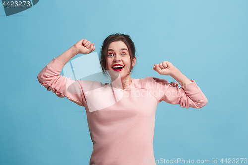 Image of Winning success woman happy ecstatic celebrating being a winner. Dynamic energetic image of female model