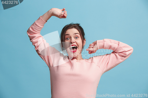 Image of Winning success woman happy ecstatic celebrating being a winner. Dynamic energetic image of female model