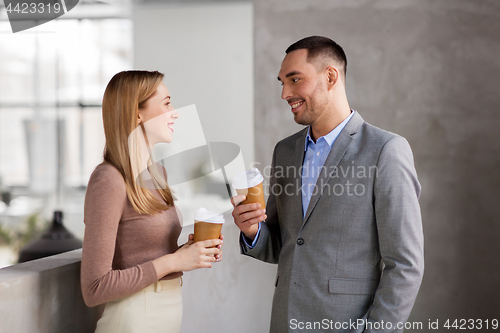 Image of businesswoman and businessman at coffee break