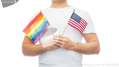 Image of man with gay pride rainbow and american flag