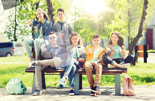 Image of group of students with tablet pc at school yard