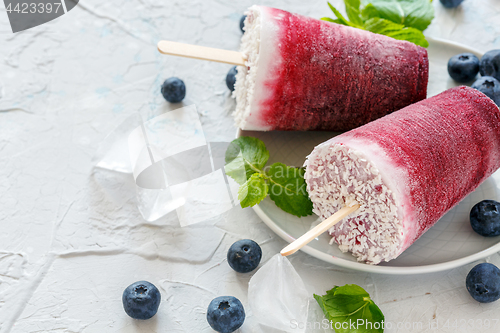 Image of Plate of vegan berry popsicles with coconut milk.