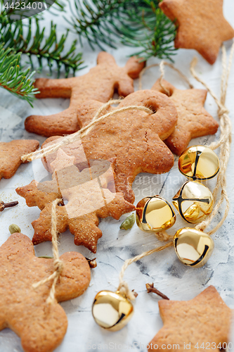 Image of Gingerbread Christmas toys and golden bells.