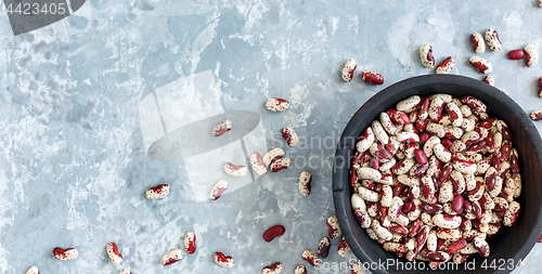 Image of Motley beans in an old wooden bowl.