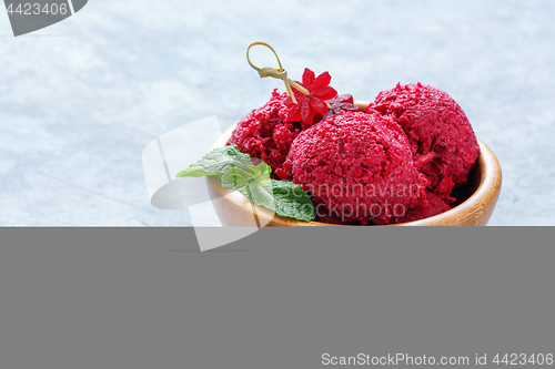 Image of Artisanal beetroot ice cream in a wooden bowl.