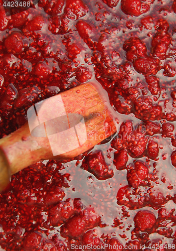 Image of Raspberry jam and wooden blade