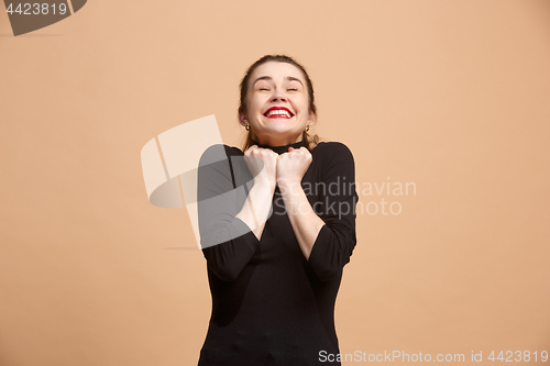 Image of Winning success woman happy ecstatic celebrating being a winner. Dynamic energetic image of female model