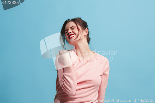 Image of Winning success woman happy ecstatic celebrating being a winner. Dynamic energetic image of female model