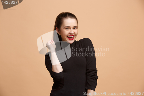 Image of Winning success woman happy ecstatic celebrating being a winner. Dynamic energetic image of female model