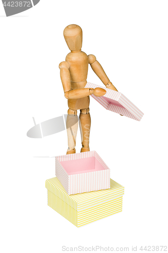 Image of Wooden mannequin with gift box