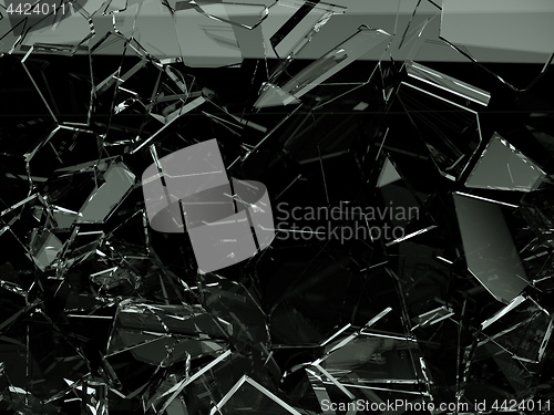 Image of Pieces of splitted or cracked glass on black