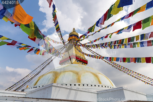 Image of Boudhanath Stupa in Kathmandu and buddhist prayer flags