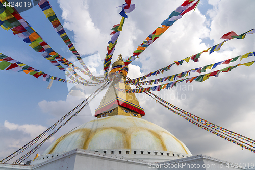 Image of Boudhanath Stupa in Kathmandu and buddhist prayer flags