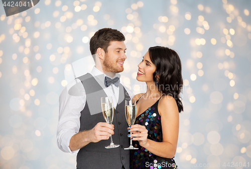 Image of happy couple with champagne glasses at party