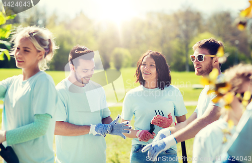 Image of group of volunteers planting tree in park