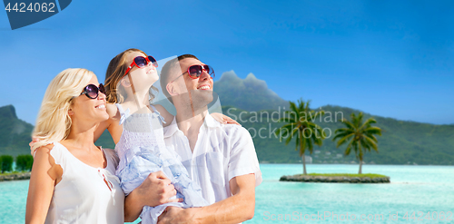 Image of happy family over bora bora background
