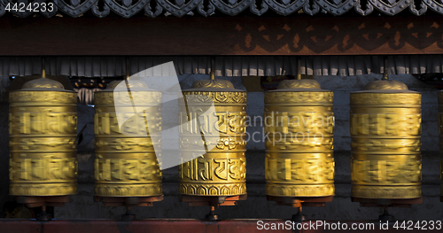 Image of Buddhist prayer wheels rotating in motion