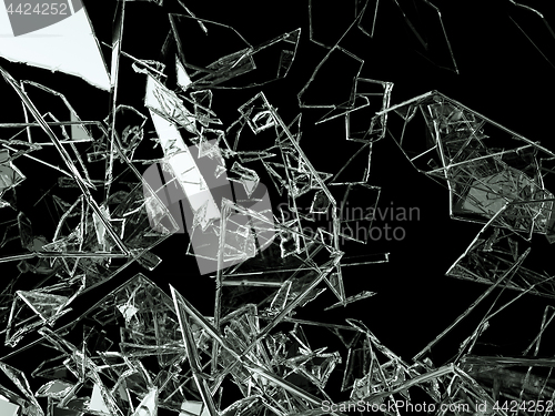 Image of Pieces of glass broken or cracked on black