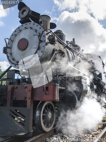 Image of Old steam locomotive or railway train arriving 