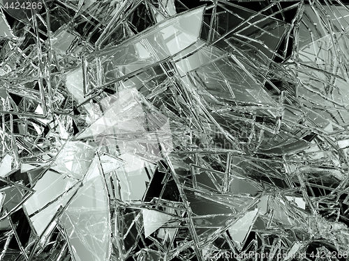 Image of Pieces of glass broken or cracked on black