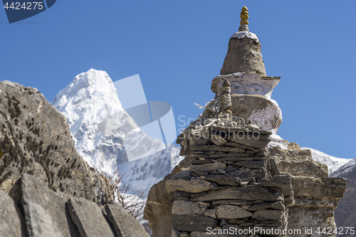 Image of Buddhist stupa and Ama Dablam summit in Khumbu region