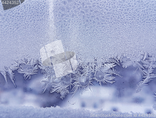 Image of Ice pattern and frozen water drops on glass