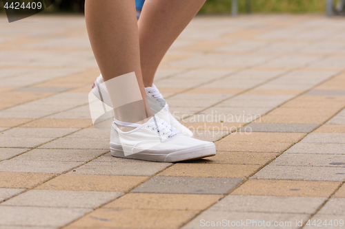 Image of Female sneakers are dressed for a girl, close-up