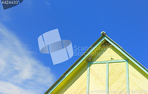 Image of Part Of A Rustic Wooden Building Against The Sky