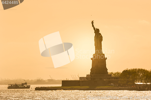 Image of Statue of Liberty silhouette in sunset, New York City, USA