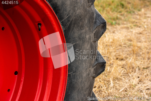 Image of Wheels of tractor plowing field