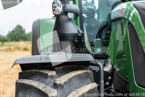 Image of Tractor plowing field
