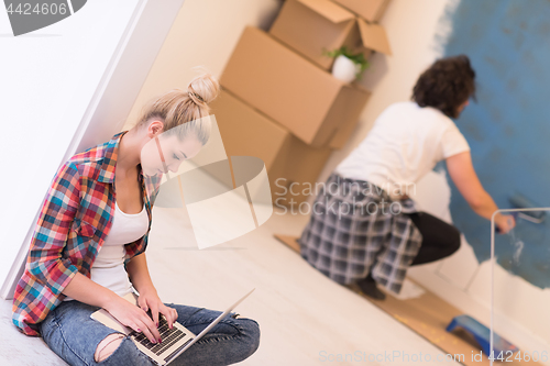 Image of Happy couple doing home renovations