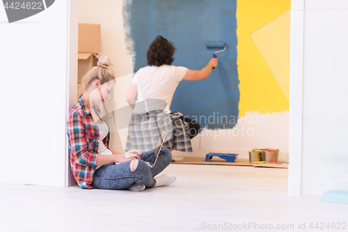 Image of Happy couple doing home renovations