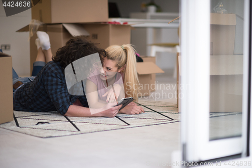 Image of Young couple moving in a new flat