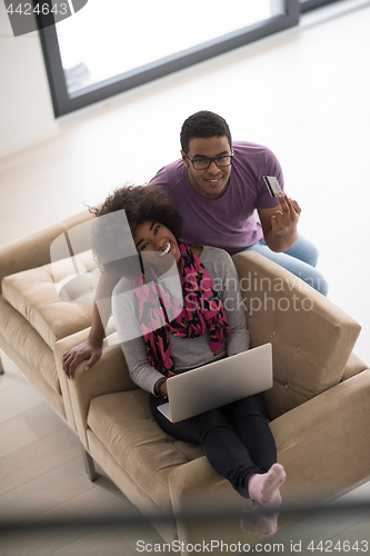 Image of african american couple shopping online