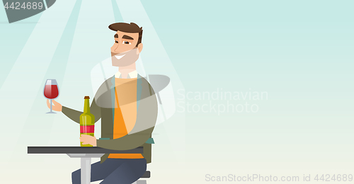 Image of Man drinking wine in the restaurant.