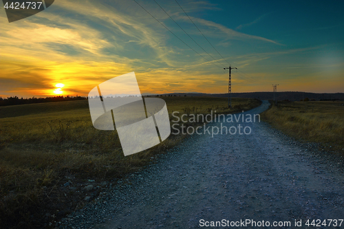 Image of orange colors of dawn on rural landscape