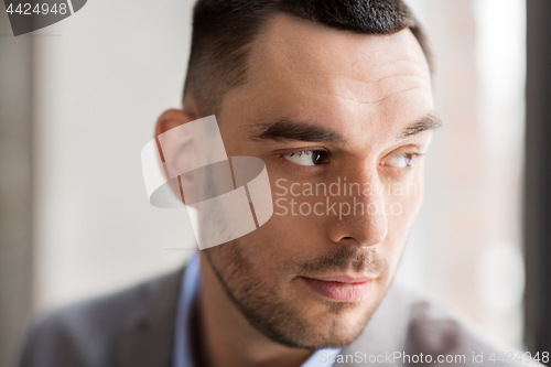 Image of portrait of businessman in suit at office