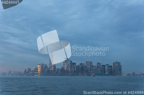 Image of Panoramic view of storm over Lower Manhattan from Ellis Island at dusk, New York City.