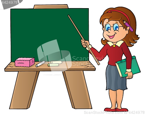 Image of Woman teacher standing by schoolboard