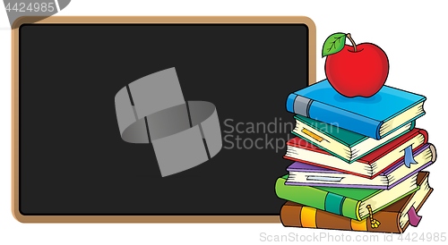 Image of Stack of books and blackboard