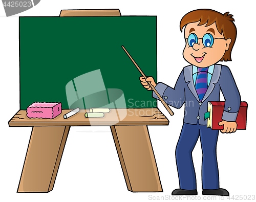 Image of Man teacher standing by schoolboard