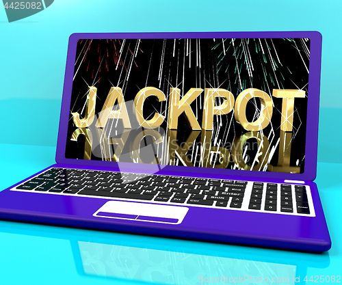 Image of Jackpot Word With Fireworks On Laptop Showing Winning