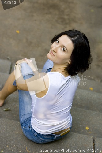 Image of woman sitting on a staircase